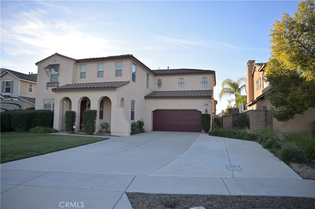 7112 Acorn Place Rancho Cucamonga, CA 91739 - Photo 1 of 40 a view of open white house with a yard and garage