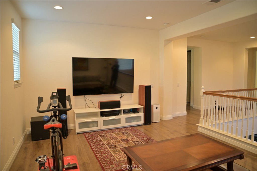 7112 Acorn Place Rancho Cucamonga, CA 91739 - Photo 19 of 40 a bedroom with a bed and a flat screen tv