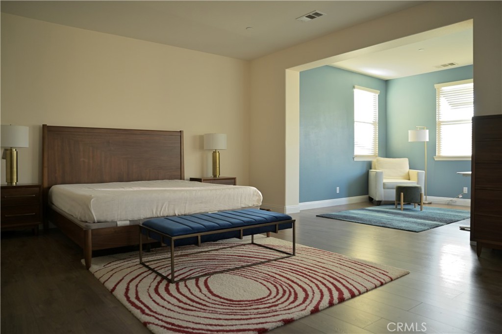 7112 Acorn Place Rancho Cucamonga, CA 91739 - Photo 21 of 40 a bedroom with a bed and wooden floor
