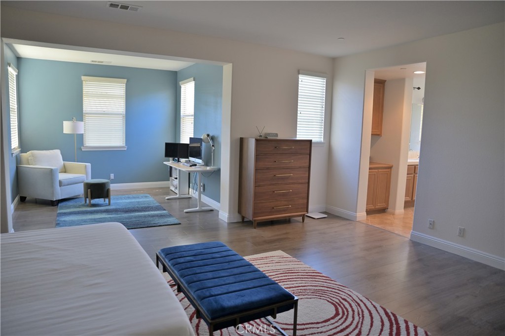 7112 Acorn Place Rancho Cucamonga, CA 91739 - Photo 23 of 40 a living room with furniture and wooden floor