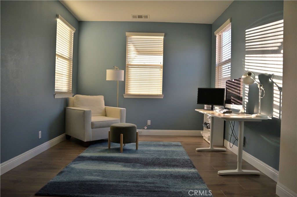 7112 Acorn Place Rancho Cucamonga, CA 91739 - Photo 25 of 40 a living room with furniture a window and a table
