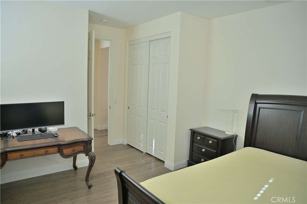 7112 Acorn Place Rancho Cucamonga, CA 91739 - Photo 27 of 40 a bedroom with a bed and a flat screen tv