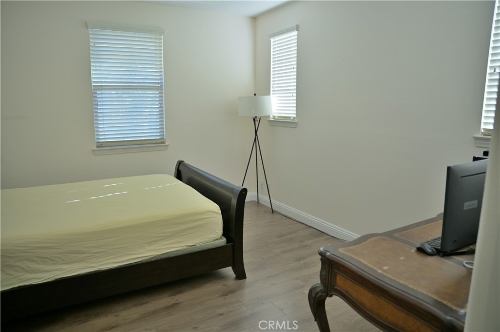 7112 Acorn Place Rancho Cucamonga, CA 91739 - Photo 28 of 40 a bedroom with a bed and a desk