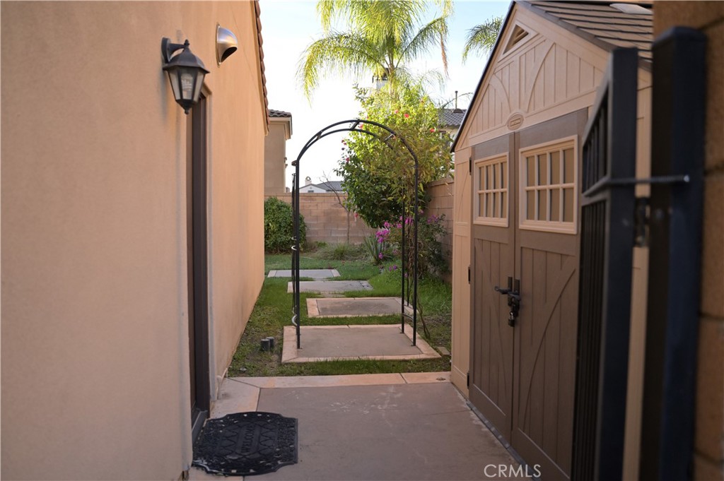 7112 Acorn Place Rancho Cucamonga, CA 91739 - Photo 36 of 40 a view of a entrance gate of the house and trees