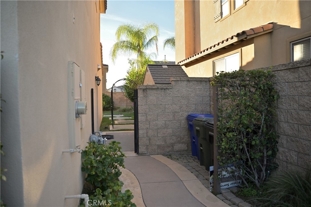 7112 Acorn Place Rancho Cucamonga, CA 91739 - Photo 37 of 40 a view of a pathway along the building