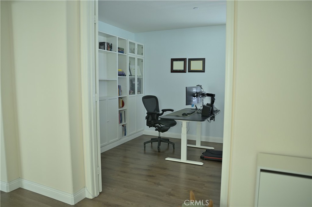 7112 Acorn Place Rancho Cucamonga, CA 91739 - Photo 5 of 40 a view of a workspace with furniture and wooden floor