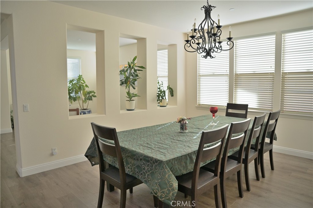7112 Acorn Place Rancho Cucamonga, CA 91739 - Photo 7 of 40 a view of a dining room with furniture and window