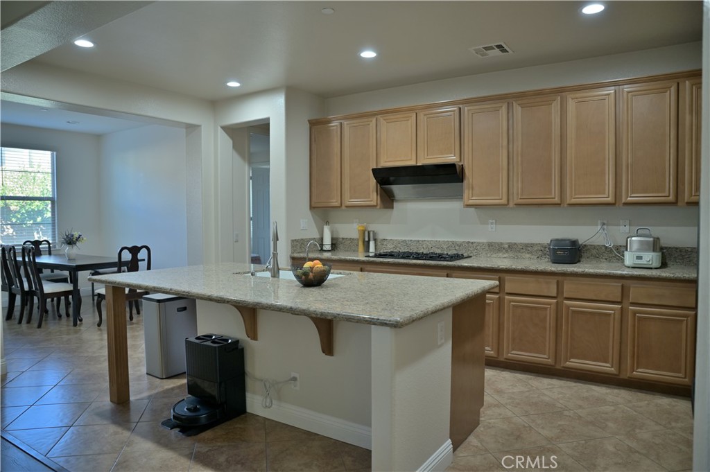 7112 Acorn Place Rancho Cucamonga, CA 91739 - Photo 8 of 40 a kitchen with a sink window and cabinets