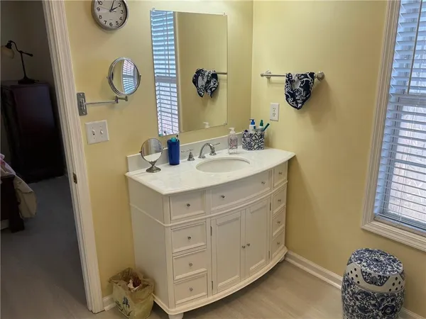 a bathroom with a sink and a mirror