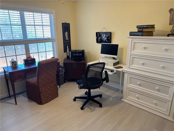 a workspace with furniture and a window
