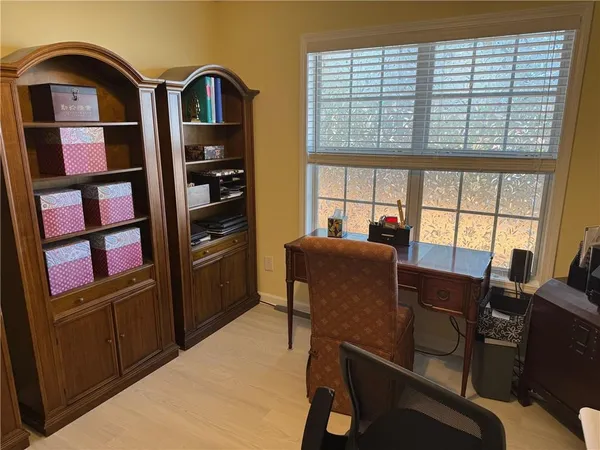 a view of a workspace with furniture