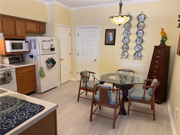 a dining room with furniture and window