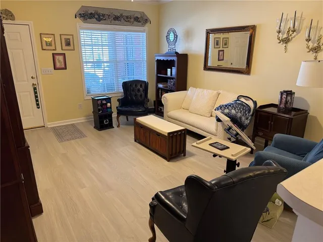 a living room with furniture window and a fireplace