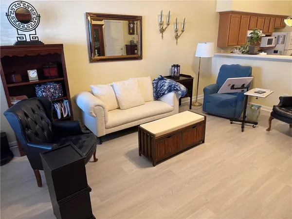 a living room with furniture and a lamp