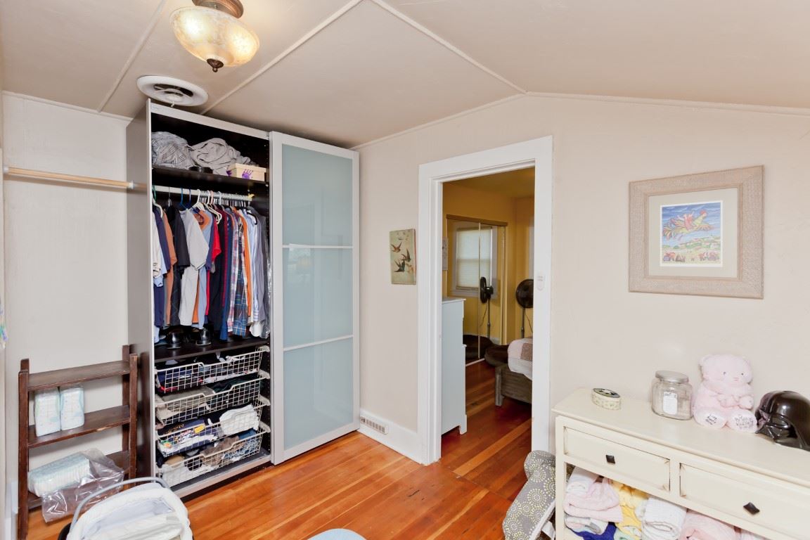 2390 H Road Grand Junction, CO 81505 - Photo 14 of 42 a view of a bedroom with wooden floor and closet