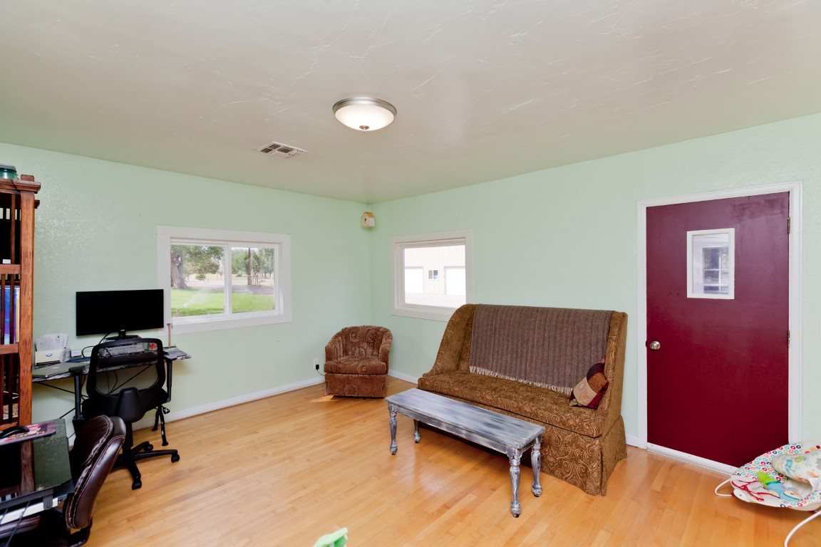 2390 H Road Grand Junction, CO 81505 - Photo 7 of 42 a view of a workspace with furniture and a window