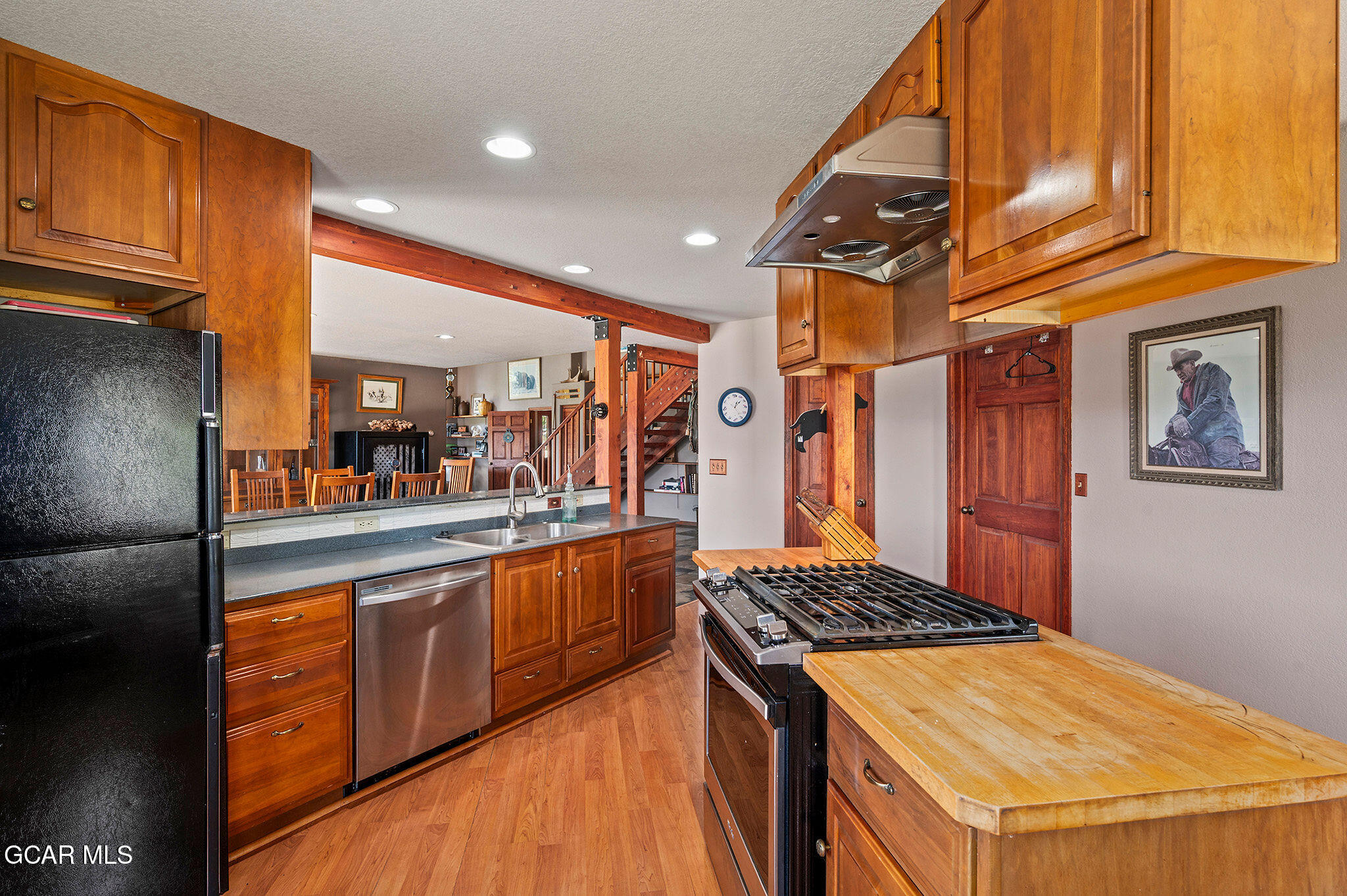 732 Gcr 8311/ Clayton Ranch Road Tabernash, CO 80478 - Photo 14 of 65 a kitchen with stainless steel appliances granite countertop a stove and a refrigerator