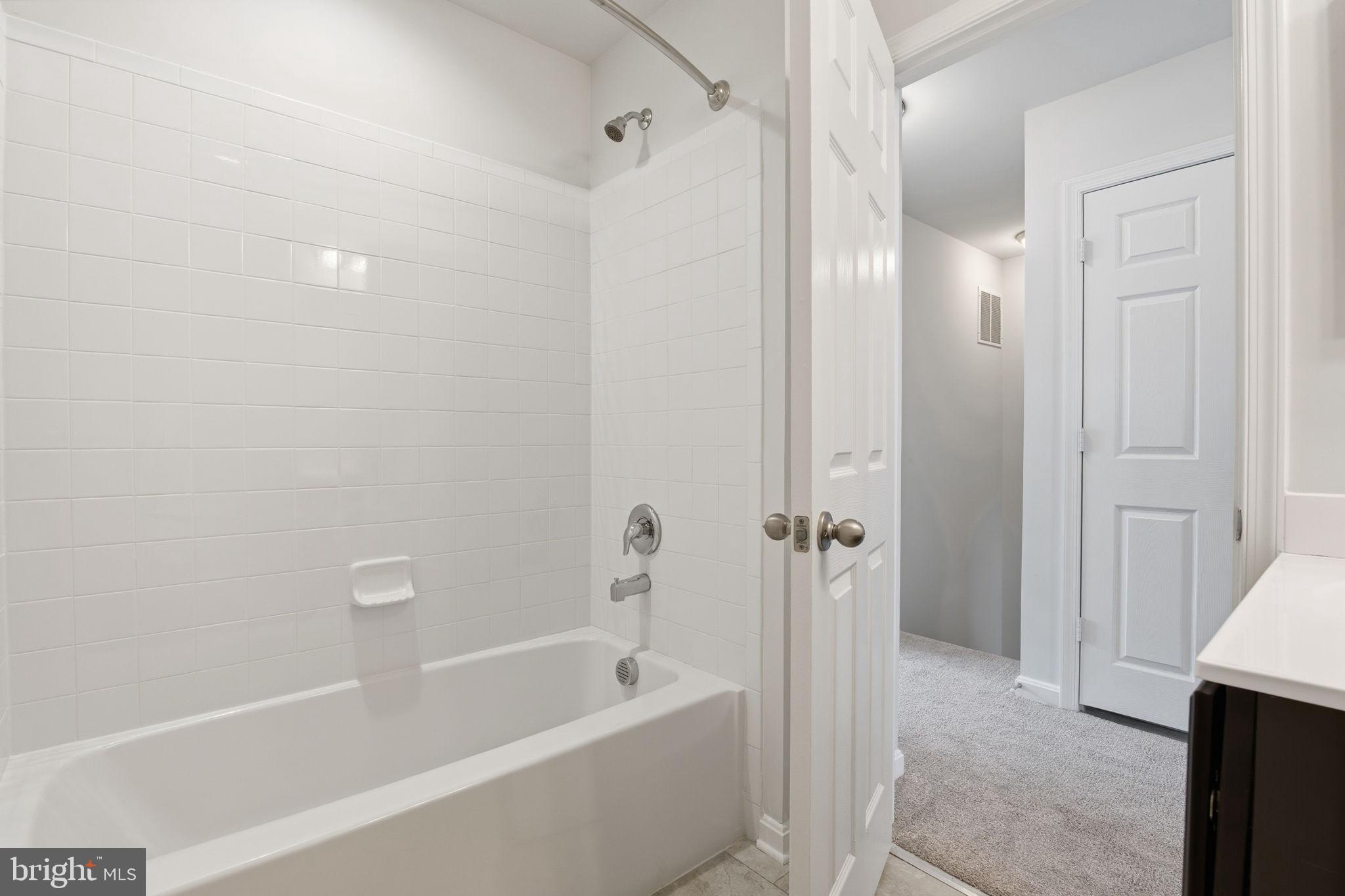 345 Tumblers Way, Unit 20 Joppa, MD 21085 - Photo 28 of 34 a bathroom with a bathtub and a shower