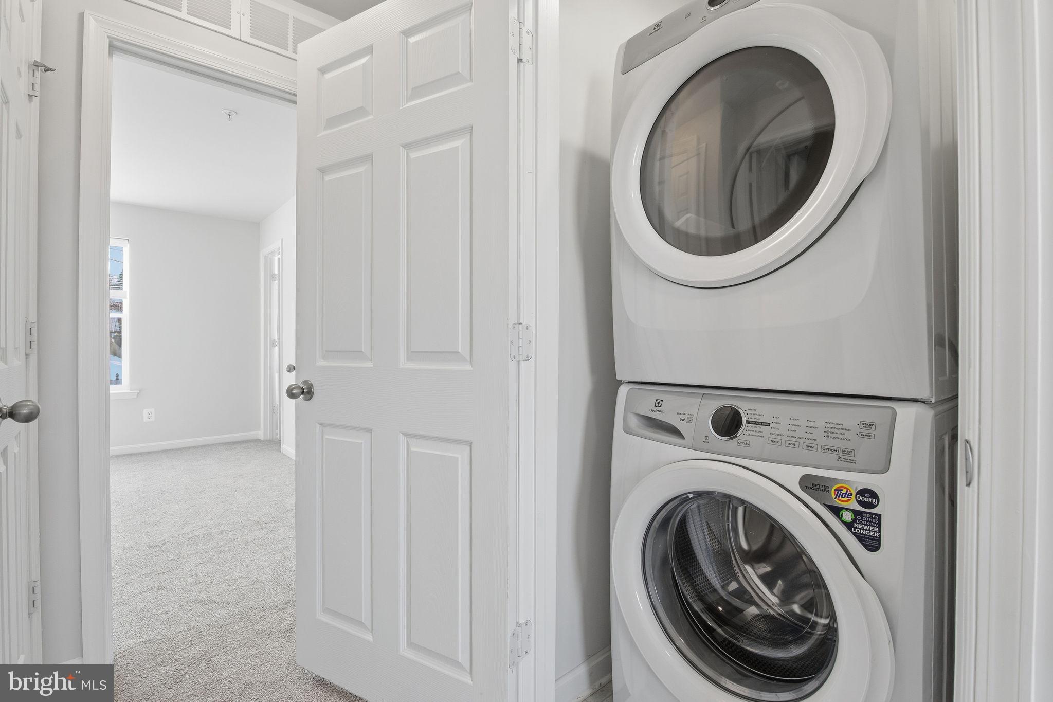 345 Tumblers Way, Unit 20 Joppa, MD 21085 - Photo 30 of 34 a view of a hallway with washer and dryer