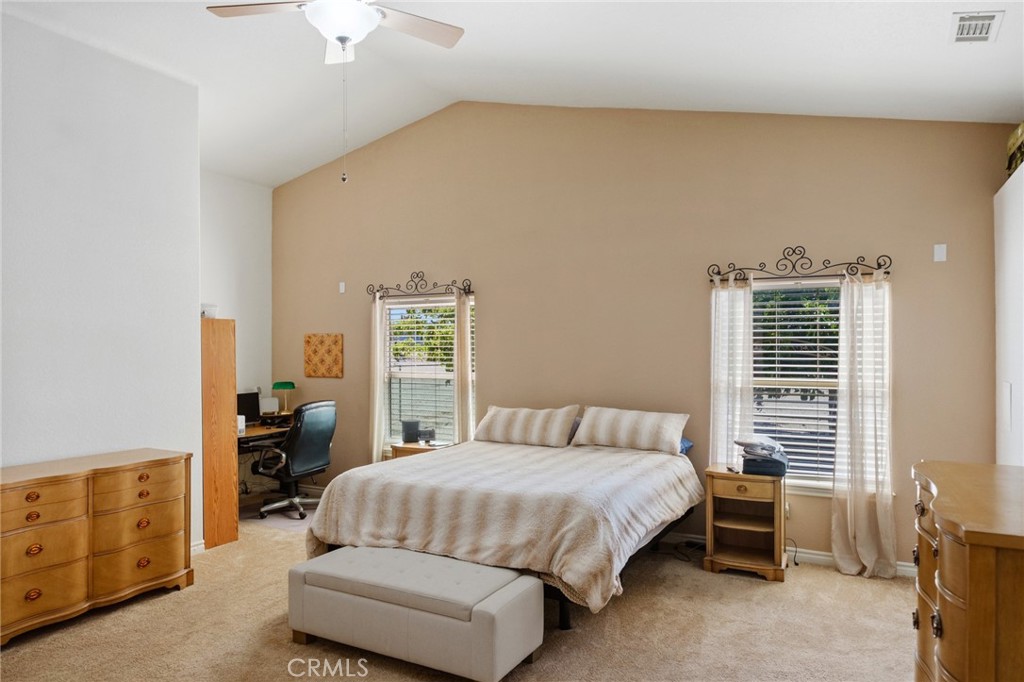 11025 El Esteban Road Phelan, CA 92371 - Photo 33 of 54 a bedroom with a bed and a dresser