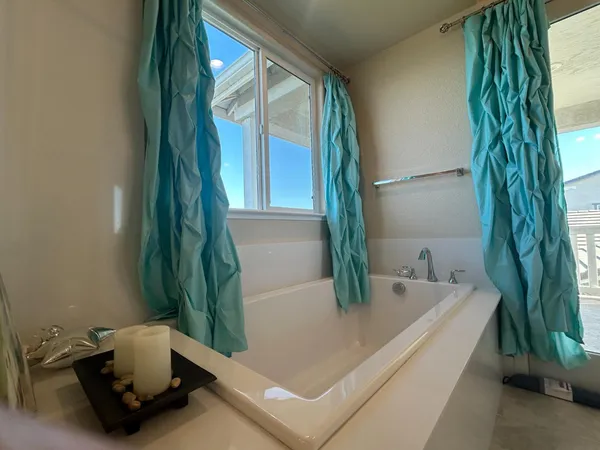 a bathroom with a tub and a sink