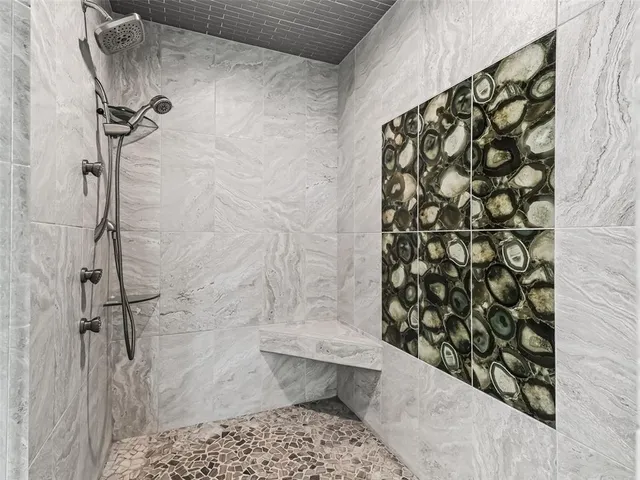 a bathroom with a toilet and a shower curtain