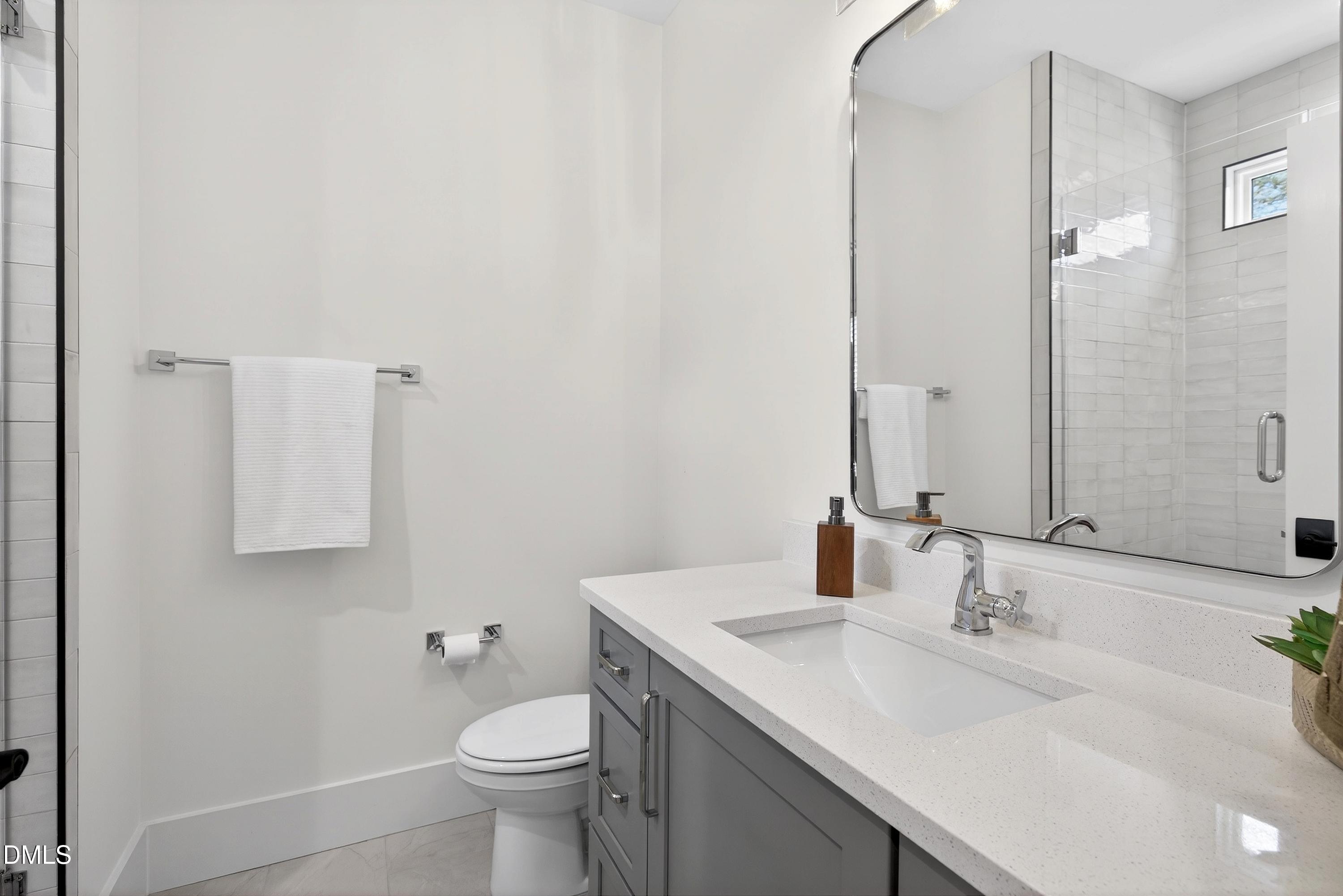 113 Boyd Street Cary, NC 27513 - Photo 51 of 88 a bathroom with a sink toilet and mirror