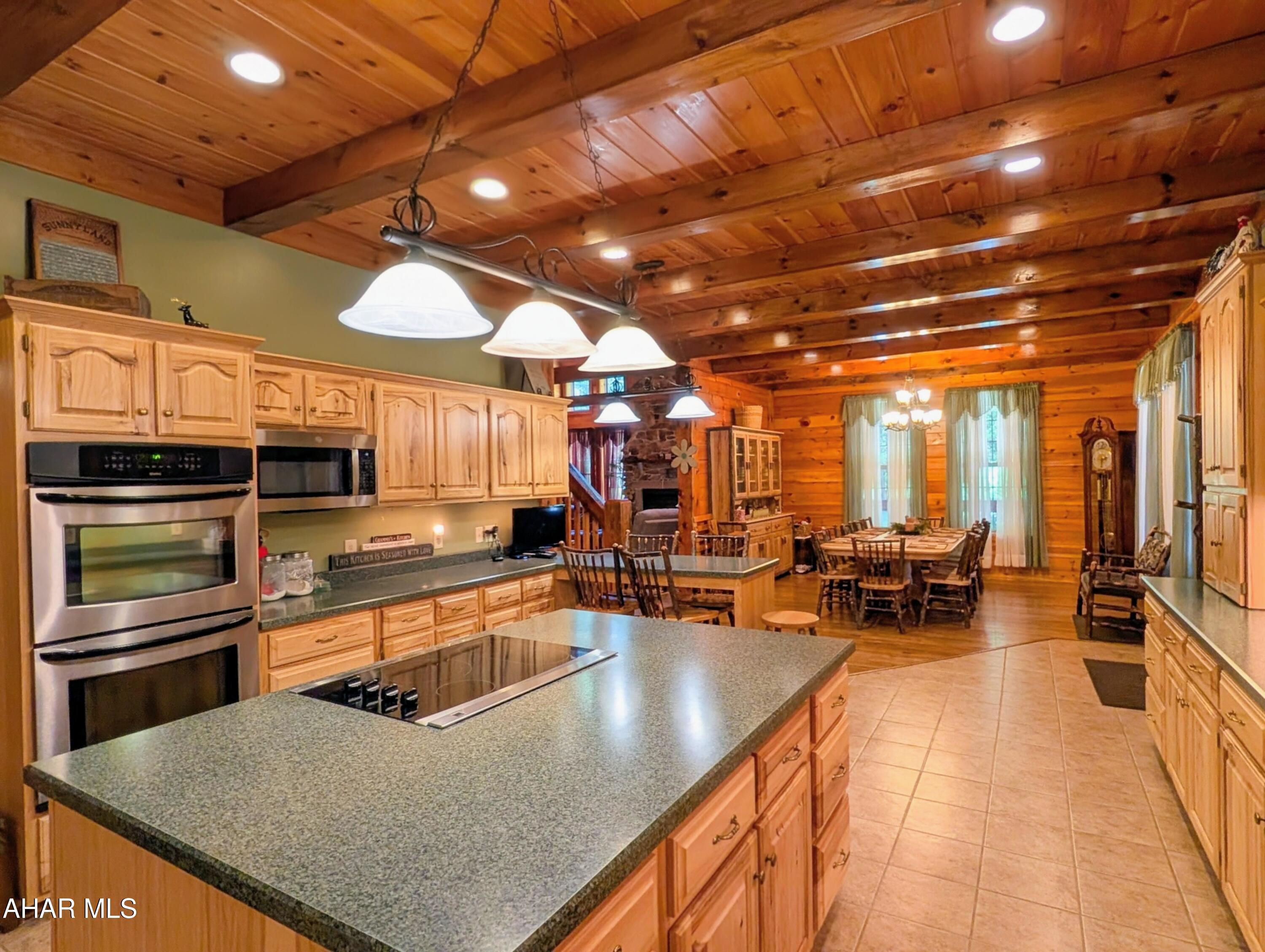 213 Sherman Valley Road Hopewell, PA 16650 - Photo 6 of 104 a kitchen with stainless steel appliances granite countertop a lot of counter space