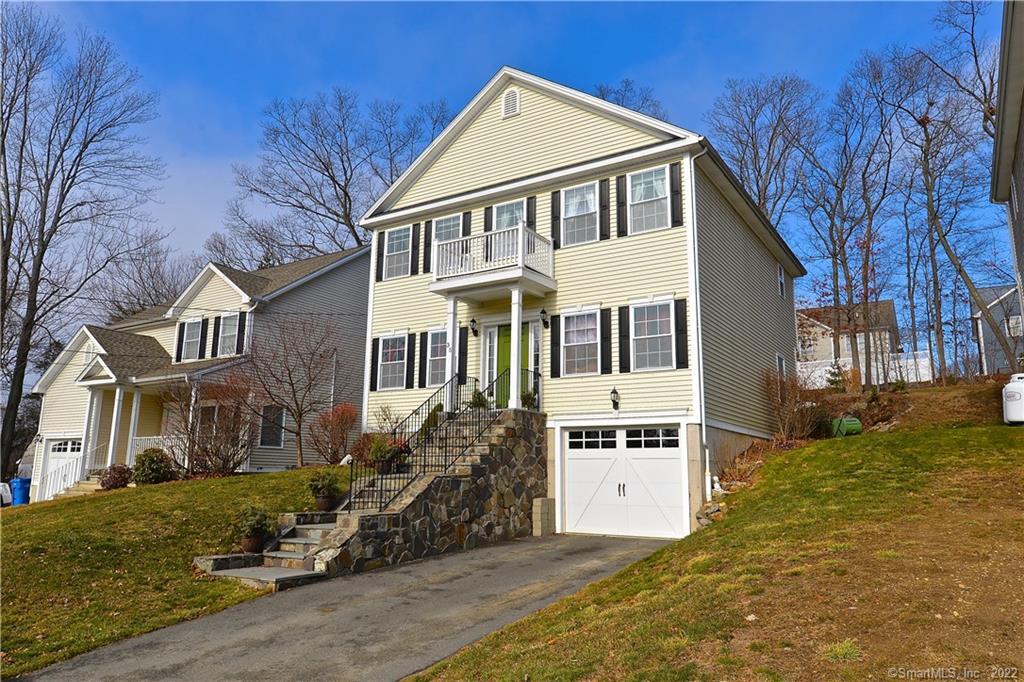 Exterior front, yard, and house next door and street behind house ( Chapin)