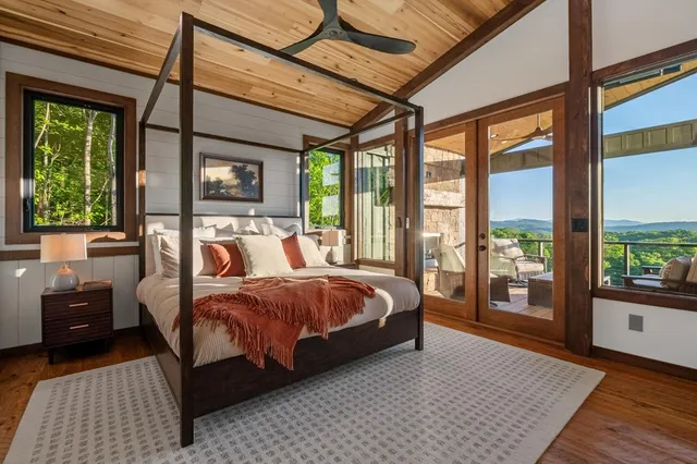 a bathroom with a double vanity sink a toilet and a mirror