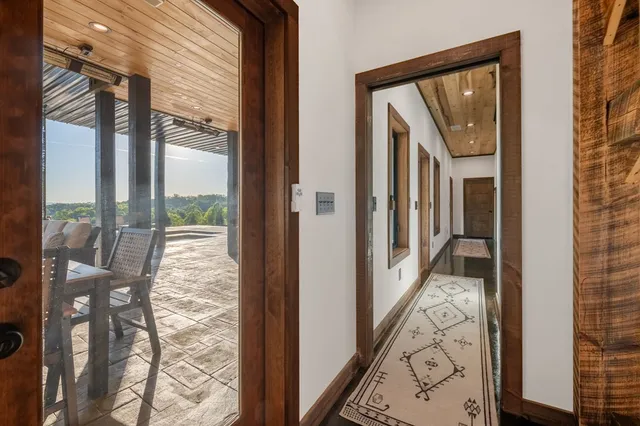 a view of a swimming pool with a patio and a yard