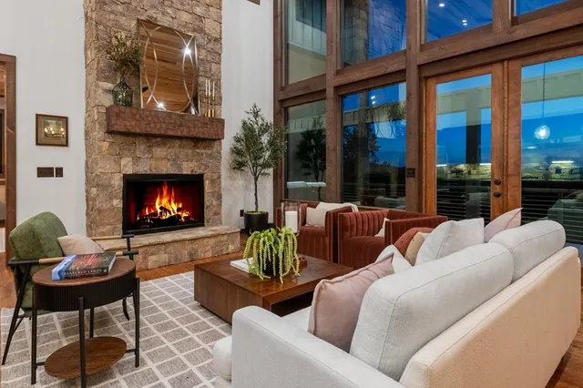 a living room with furniture a lamp and a fireplace