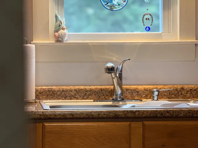 a view of a sink and a window