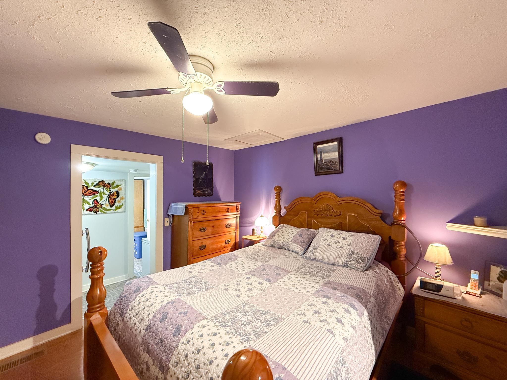 1249 Pounding Creek Road Charlottesville, VA 22903 - Photo 17 of 20 a bedroom with a bed and a chandelier