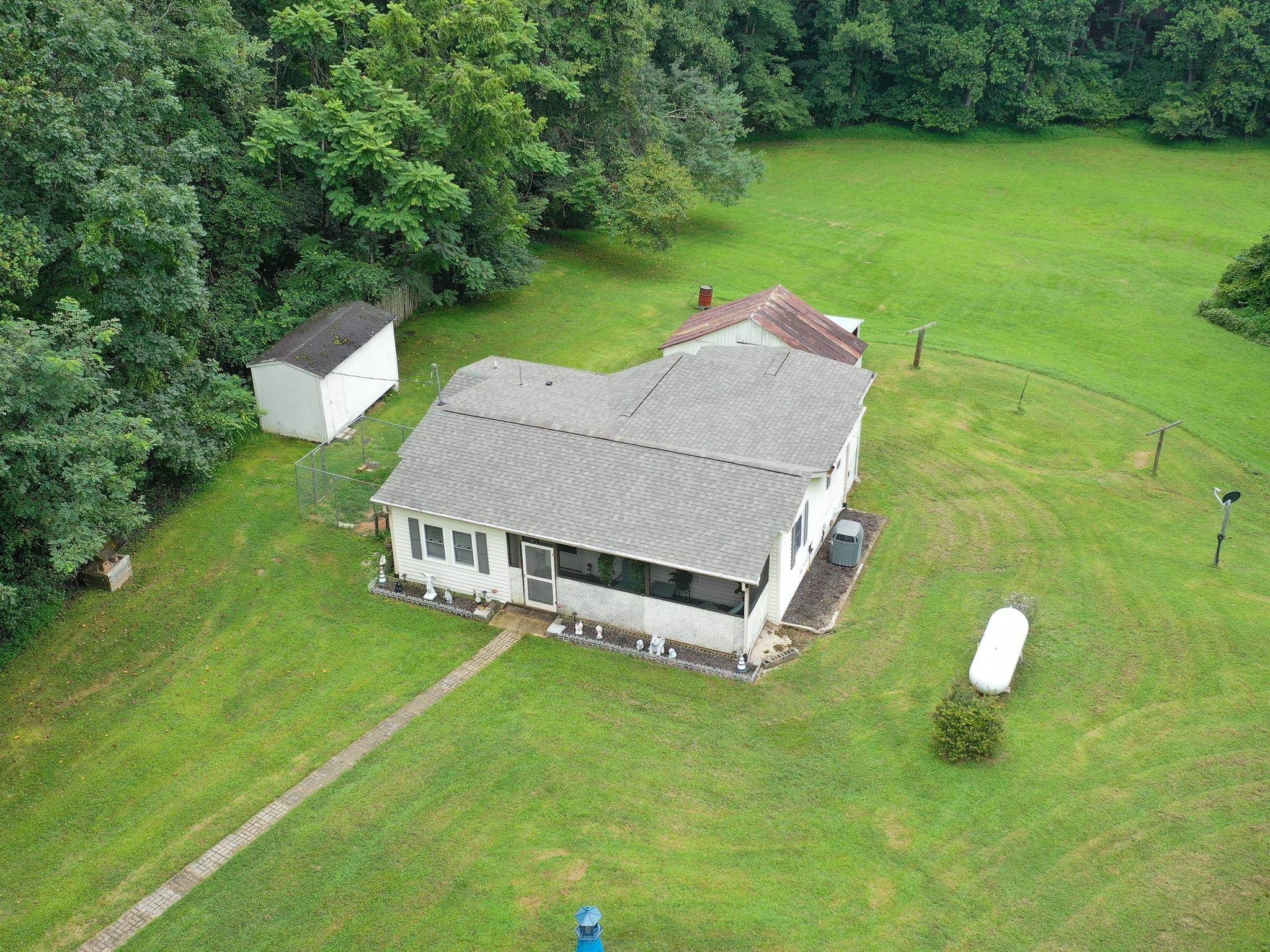 1249 Pounding Creek Road Charlottesville, VA 22903 - Photo 2 of 20 an aerial view of a house with a garden and swimming pool