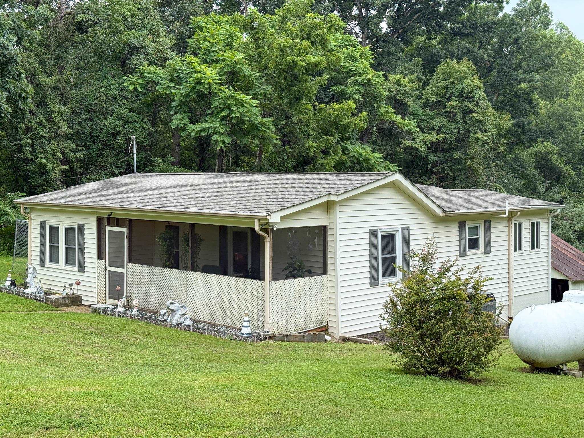 1249 Pounding Creek Road Charlottesville, VA 22903 - Photo 7 of 20 a front view of a house with a yard