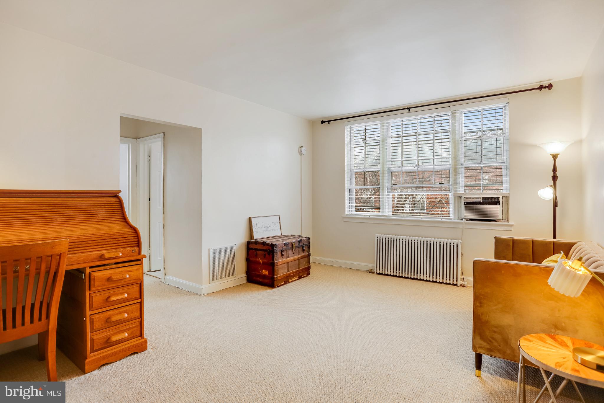 1446 Tuckerman Street Northwest, Unit 307 Washington, DC 20011 - Photo 8 of 18 a view of livingroom with furniture and windows
