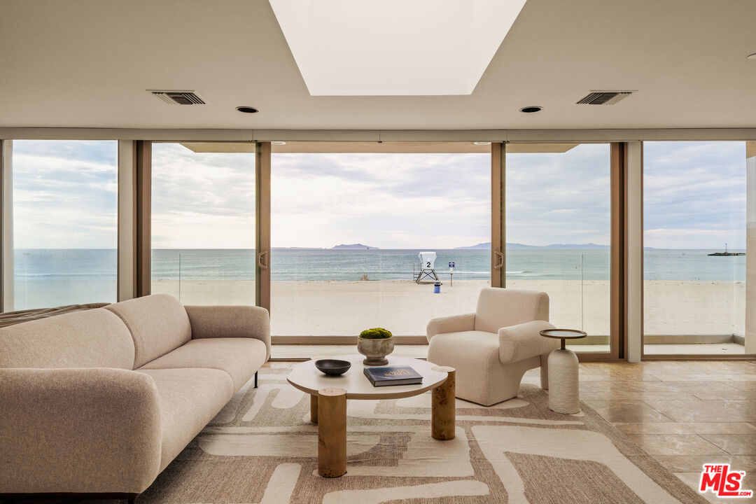 1825 Ocean Drive Oxnard, CA 93035 - Photo 11 of 29 a living room with furniture and floor to ceiling window