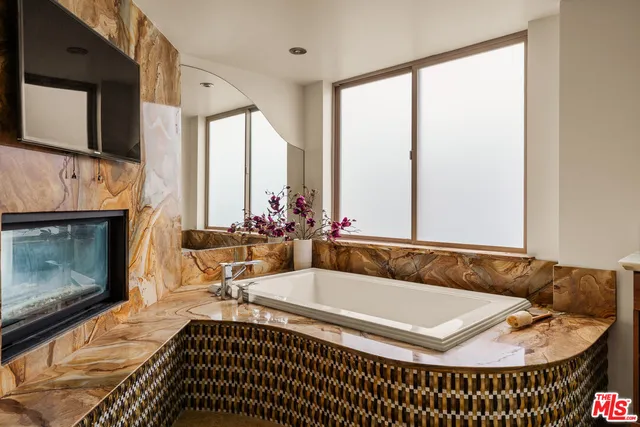 a living room with a couch and a fireplace