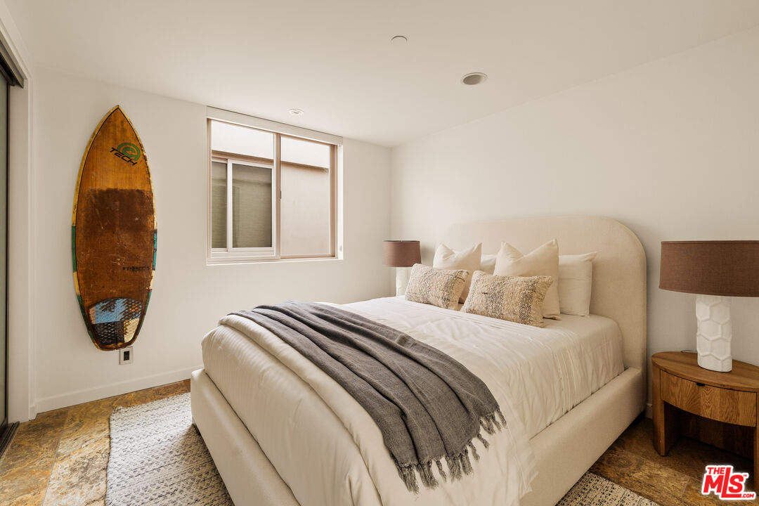 1825 Ocean Drive Oxnard, CA 93035 - Photo 18 of 29 a bedroom with a bed and a painting on the wall