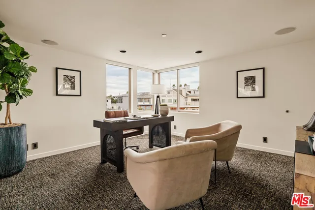 a living room with furniture and window