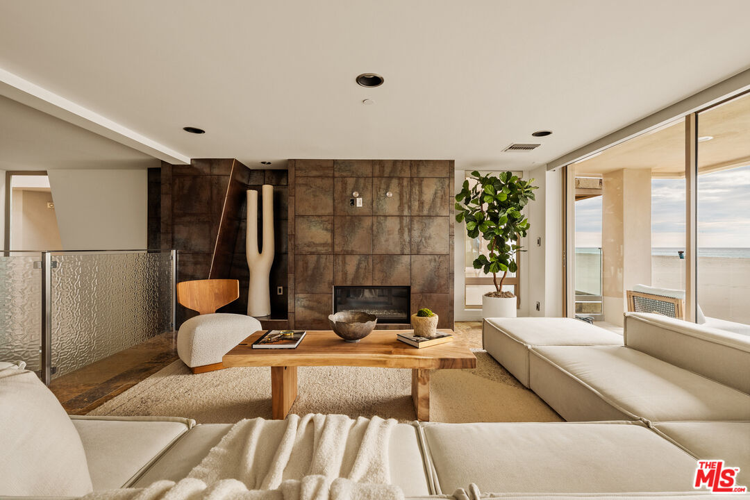 1825 Ocean Drive Oxnard, CA 93035 - Photo 2 of 29 a living room with furniture and a fireplace