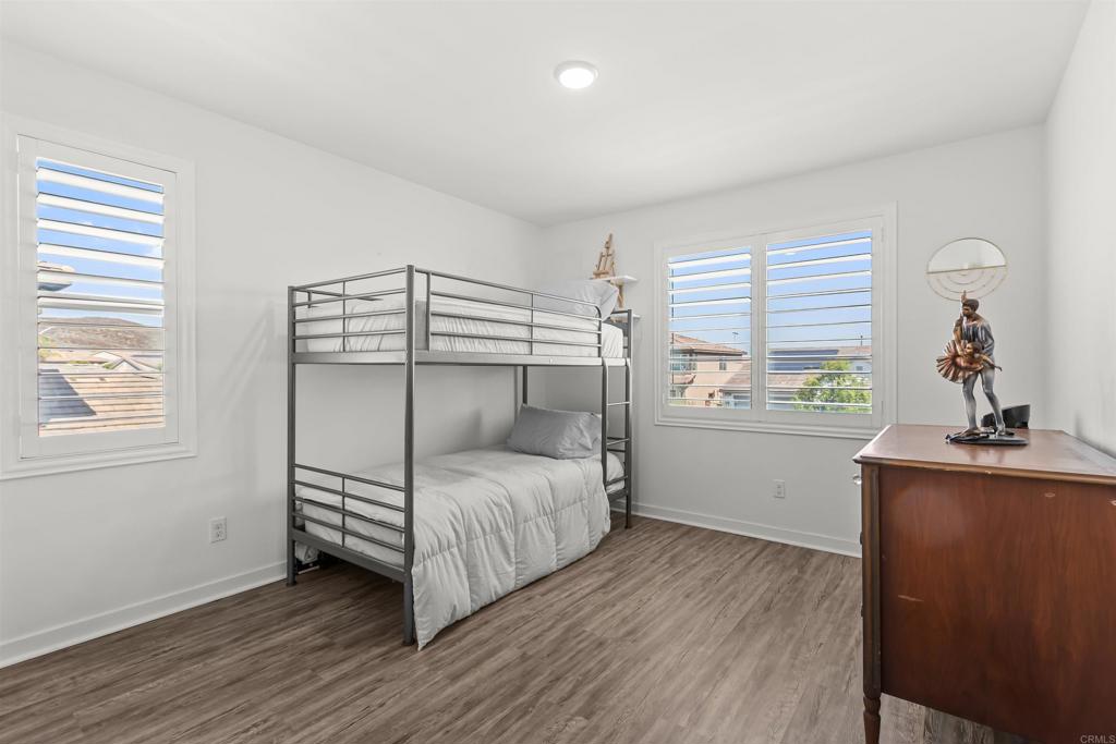 29809 Gypsy Vanner Way Menifee, CA 92584 - Photo 25 of 45 a bedroom with a bed and a window