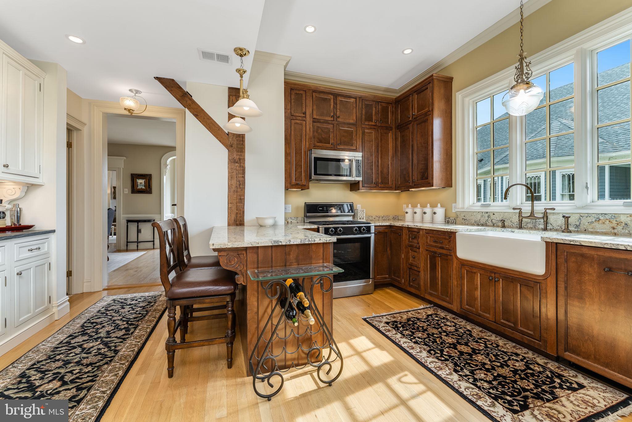 68 West Main Street Clinton, NJ 08809 - Photo 16 of 29 a kitchen with a sink and wooden cabinets