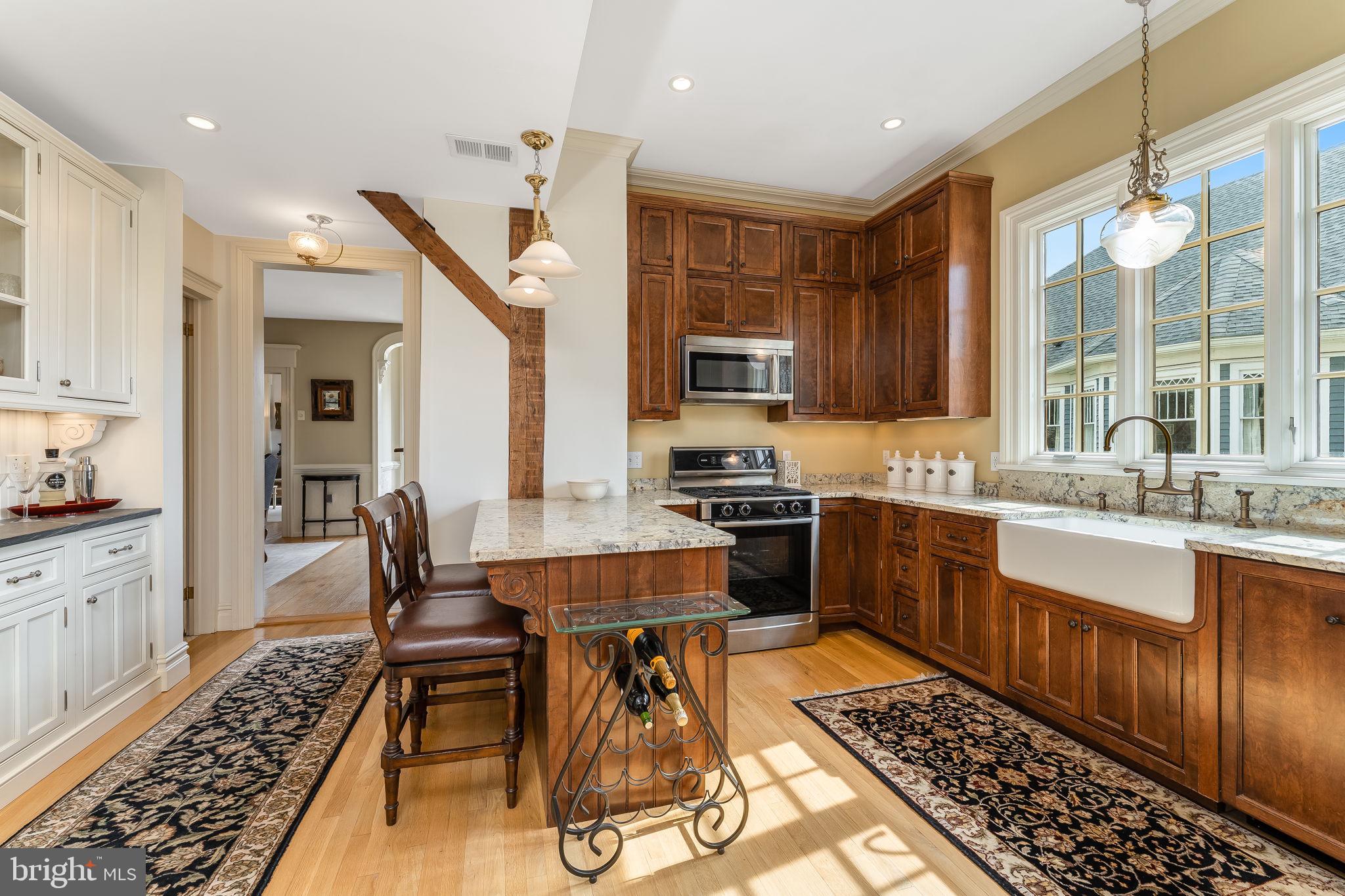 68 West Main Street Clinton, NJ 08809 - Photo 17 of 29 a kitchen with stainless steel appliances kitchen island granite countertop a sink and cabinets