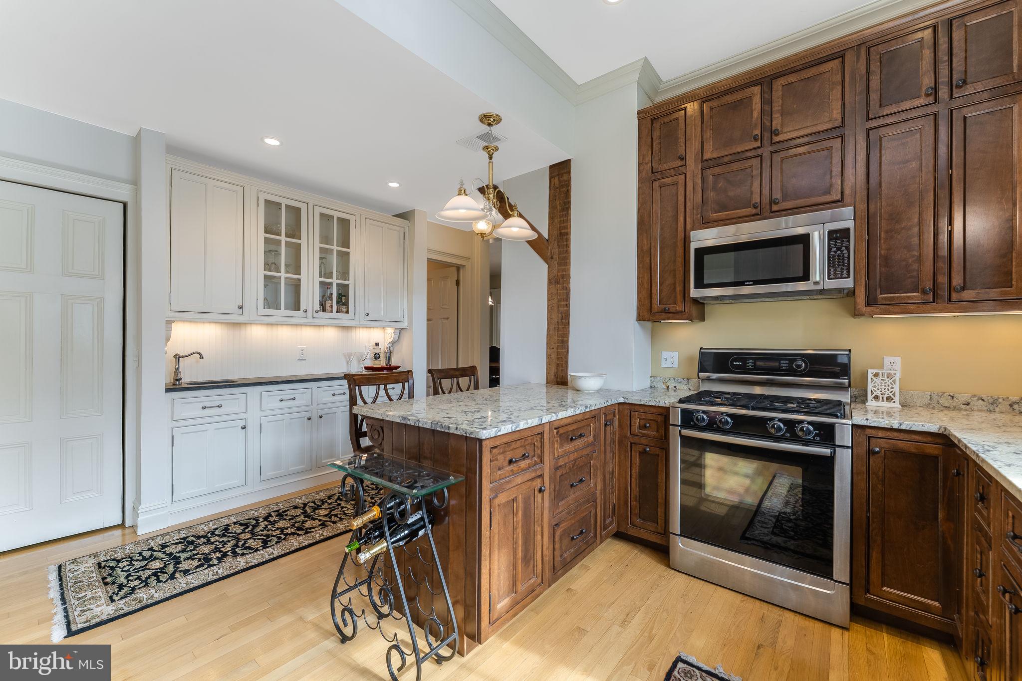 68 West Main Street Clinton, NJ 08809 - Photo 18 of 29 a kitchen with a stove and a microwave