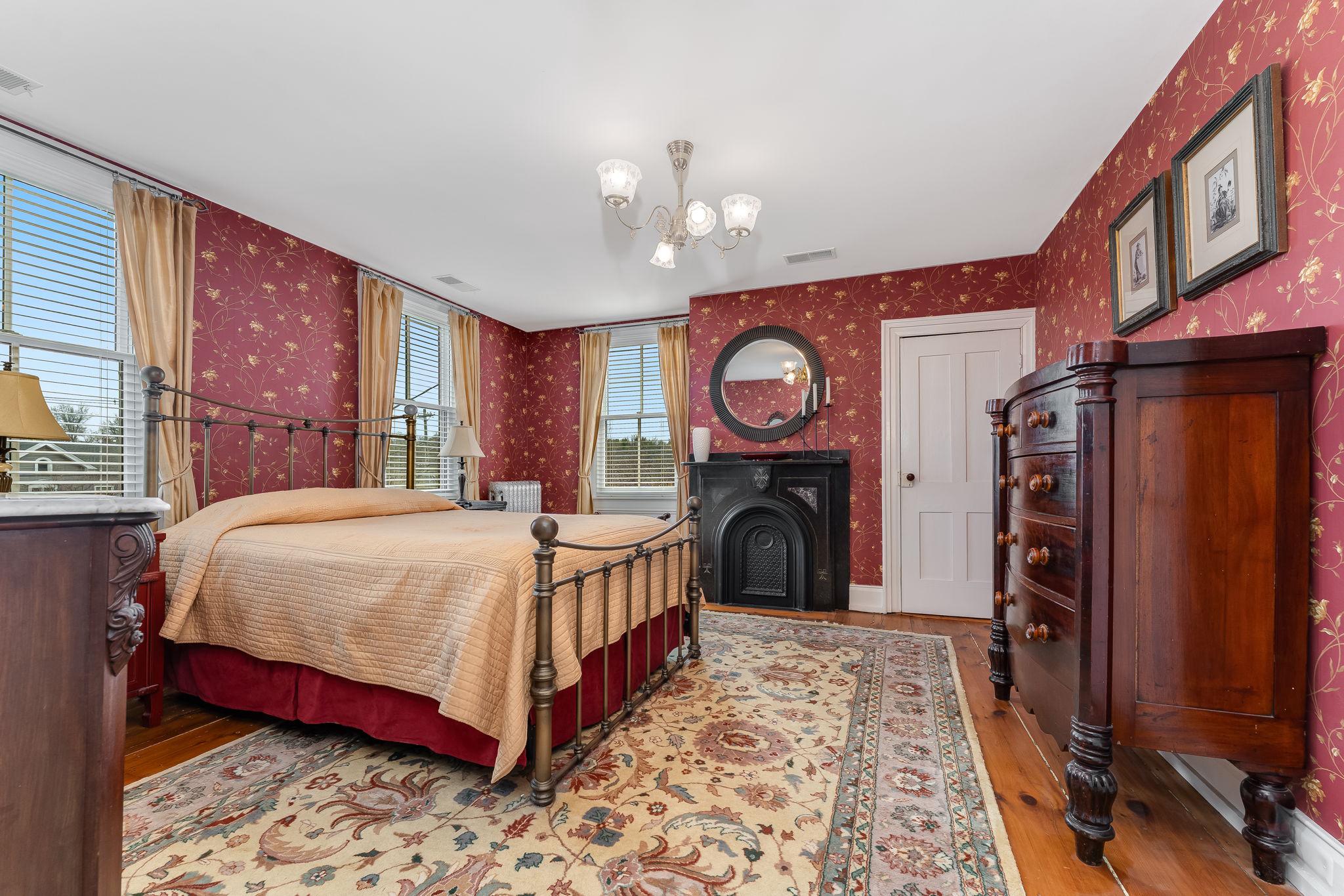 68 West Main Street Clinton, NJ 08809 - Photo 22 of 29 a bed sitting in a bedroom next to a window