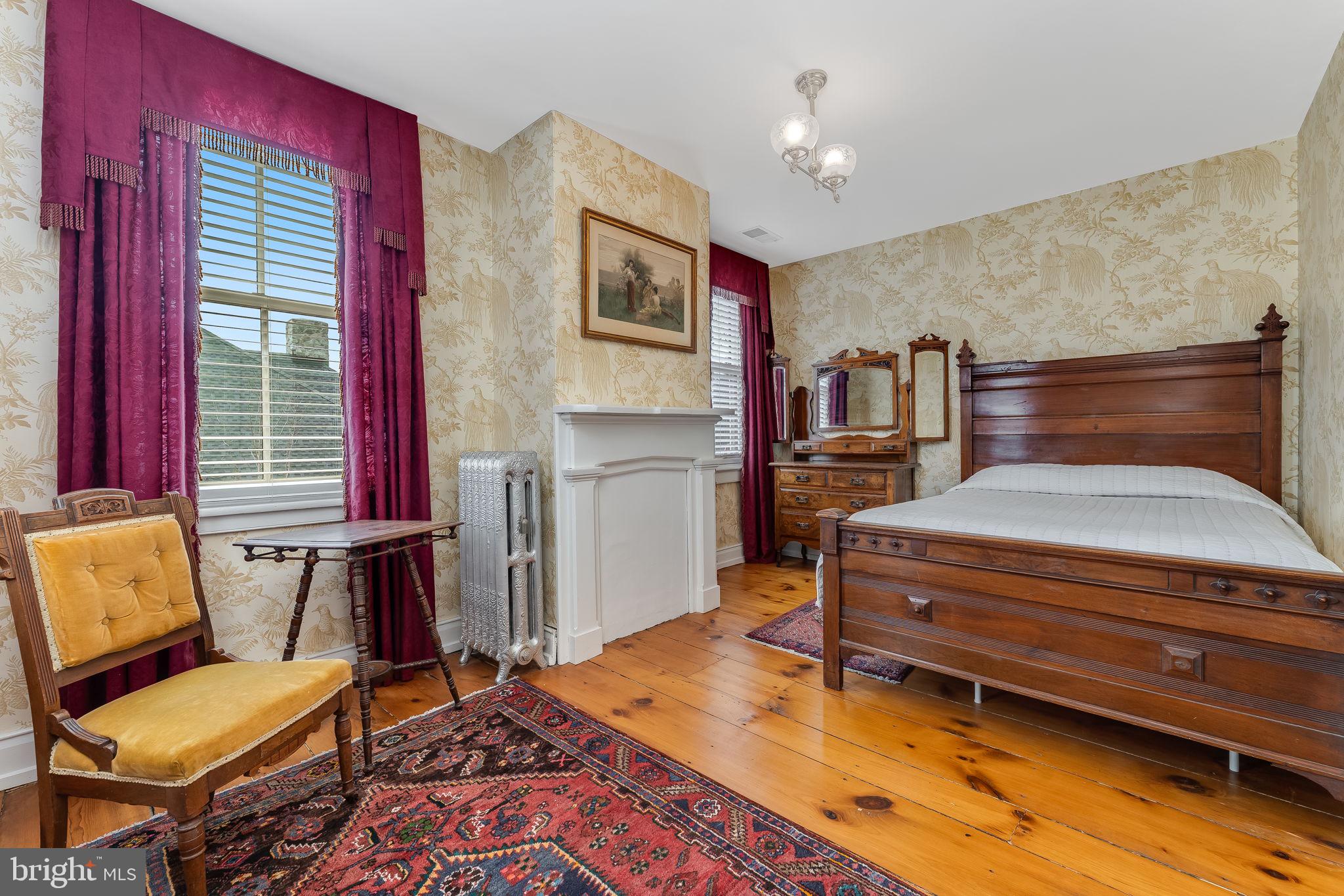 68 West Main Street Clinton, NJ 08809 - Photo 23 of 29 a bedroom with furniture and a rug