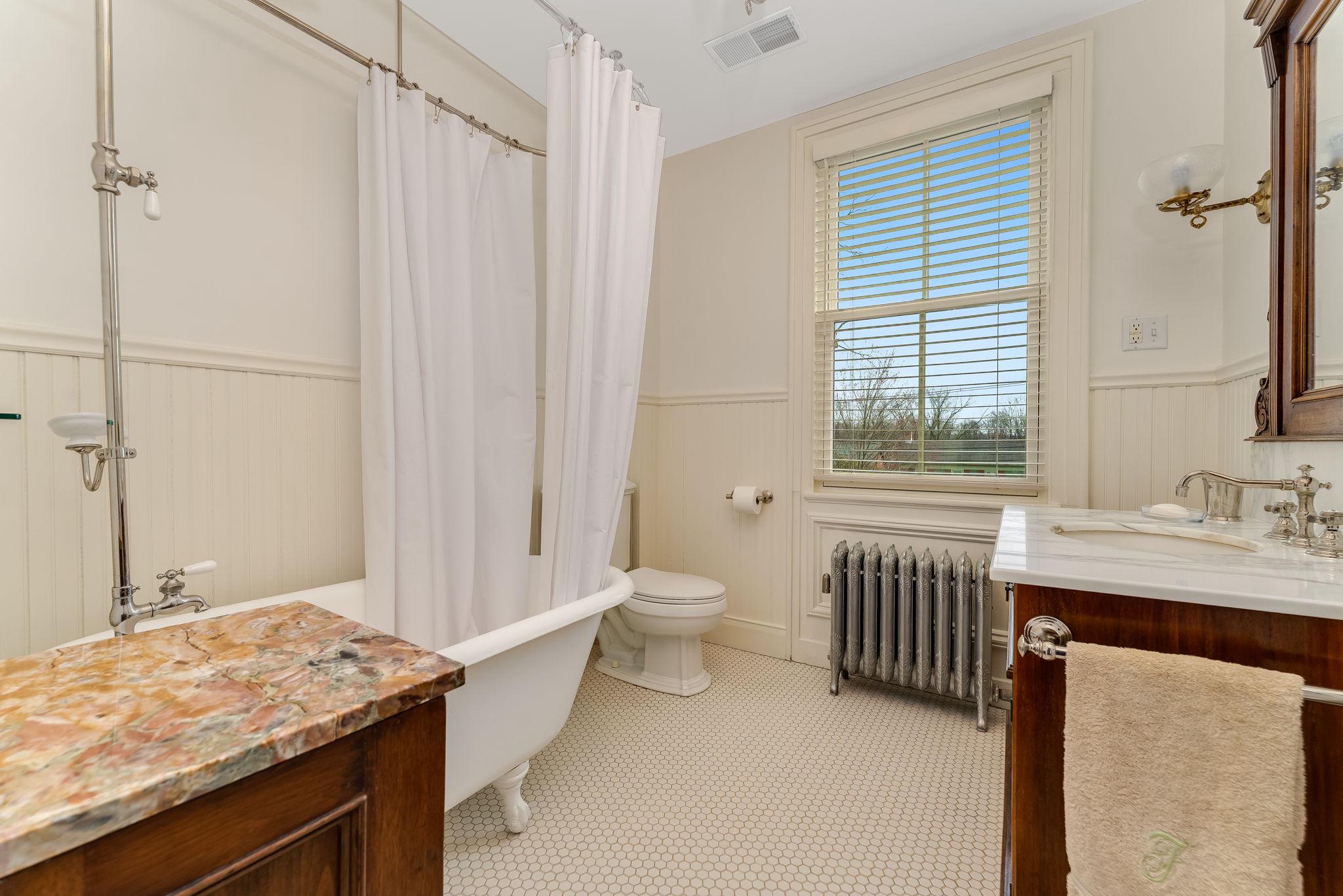 68 West Main Street Clinton, NJ 08809 - Photo 26 of 29 a bathroom with a granite countertop sink toilet and shower