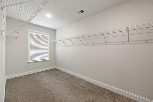 a view of a room with racks on the wall